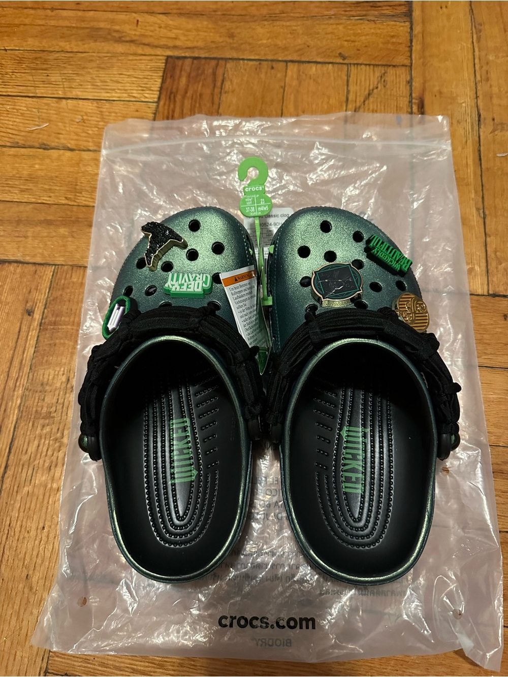 CROCS Women’s Metallic Green Classic Clog with Black Strap and Jibbitz